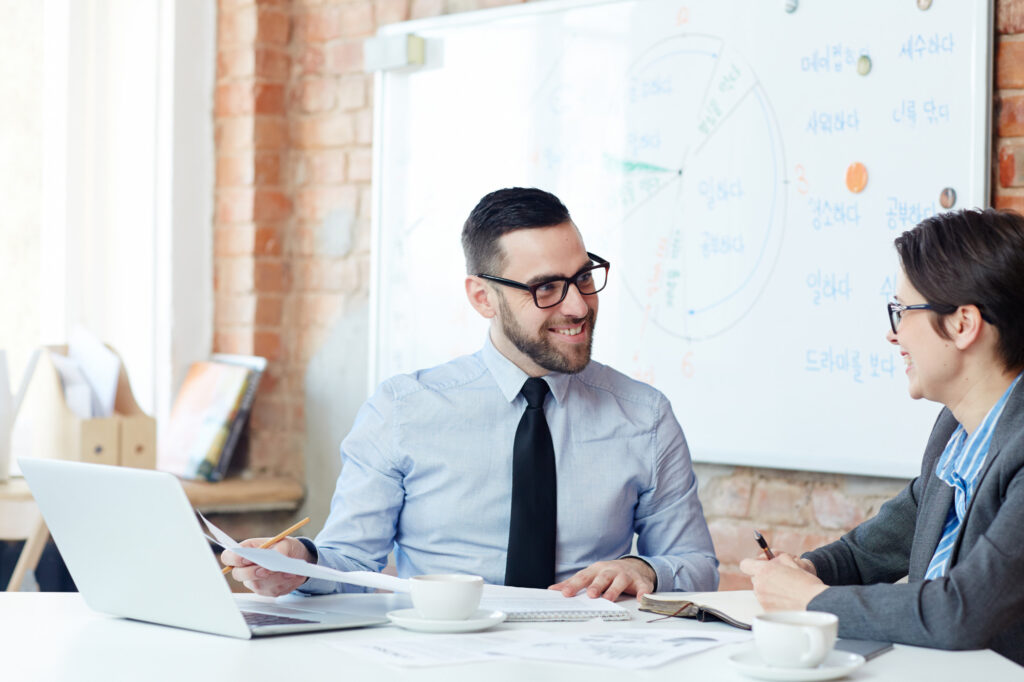 Marketing consultant presenting data-driven strategy to business owner